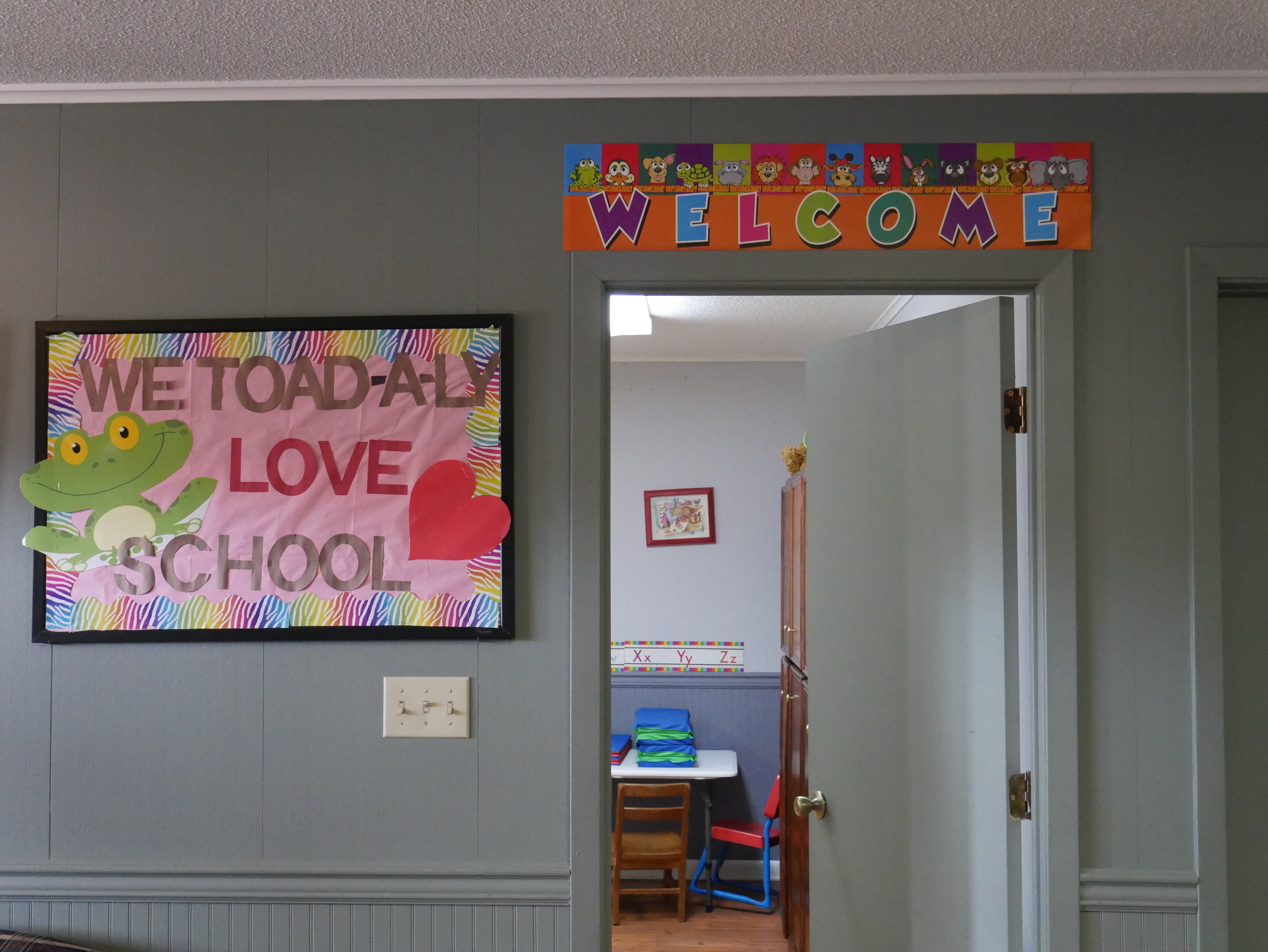 Welcome wall and doorway leading into a classroom